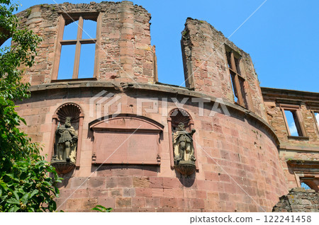 An ancient, partially ruined brick structure from Heidelberg Castle in Germany, with large arched windows An ancient, partially ruined brick structure from Heidelberg Castle in Germany, with large arched windows 122241458