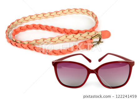 Women's red leather belt and Sunglasses isolated on white. Collage. 122241459
