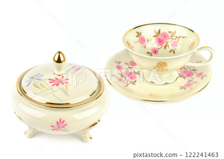 Vintage porcelain tableware: coffee cup with saucer and elegant candy bowl isolated on white. Collage. Vintage porcelain tableware: coffee cup with saucer and elegant candy bowl isolated on white. Collage. 122241463