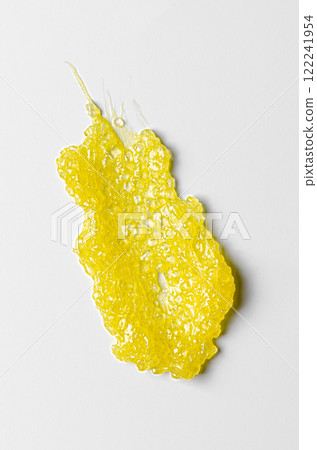 A sample of a cosmetic body care scrub. White background. A sample of a cosmetic body care scrub. White background. 122241954