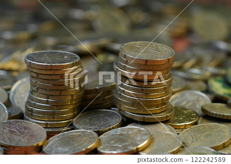 Stacks of EURO cent Coins on a Bed of Currency Stacks of EURO cent Coins on a Bed of Currency 122242589
