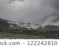 A view of the Andalusian countryside, on a rare weather day. Low clouds drifts over the landscape, with a single Finca visible amounst the Olive groves 122242810