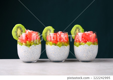 Chia pudding with kiwi, grapefruit and oatmeal. Healthy dessert for weight loss with chia seeds. Natural Vegan Dessert Chia pudding with kiwi, grapefruit and oatmeal. Healthy dessert for weight loss with chia seeds. Natural Vegan Dessert 122242995