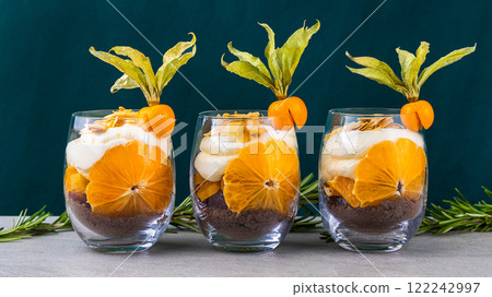 The best trifle in a glass with exquisite cream and decorated with physalis. Excellent sweet dessert The best trifle in a glass with exquisite cream and decorated with physalis. Excellent sweet dessert 122242997