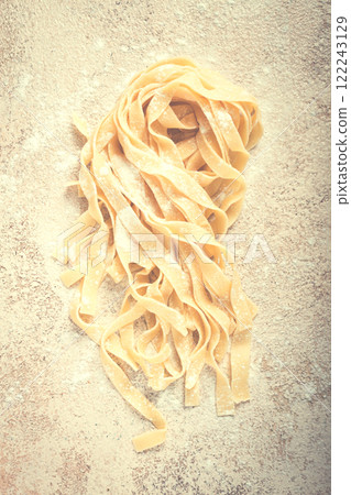 raw tagliatelli pasta , homemade, top view, no people, rustic, food concept, raw tagliatelli pasta , homemade, top view, no people, rustic, food concept, 122243129