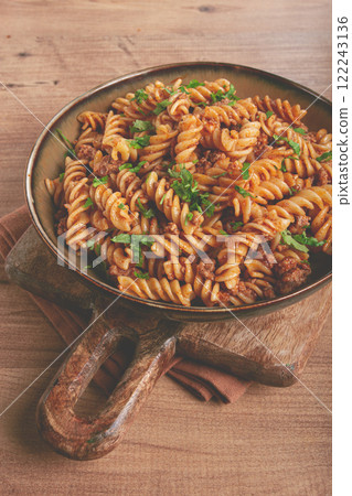 pasta in the navy, pasta with minced meat, plate on a wooden table, homemade, fusilli pasta, without people, pasta in the navy, pasta with minced meat, plate on a wooden table, homemade, fusilli pasta, without people, 122243136