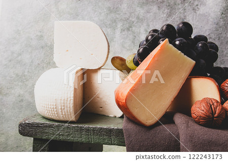 Georgian cheese, Imeretian and smoked suluguni, grapes, nuts, on a cutting board, Georgian cuisine, no people, 122243173