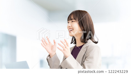 Smiling woman/businesswoman speaking at a meeting 122243229