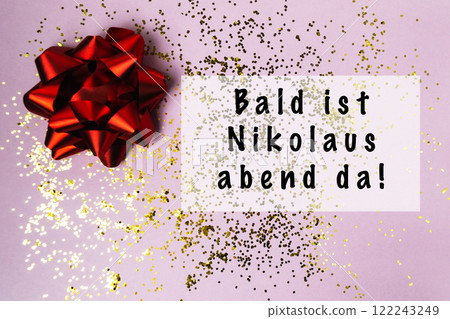 Red bow with gold glitter on a pink background 122243249