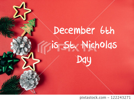 Red background with a Christmas tree and pine cones Red background with a Christmas tree and pine cones 122243271