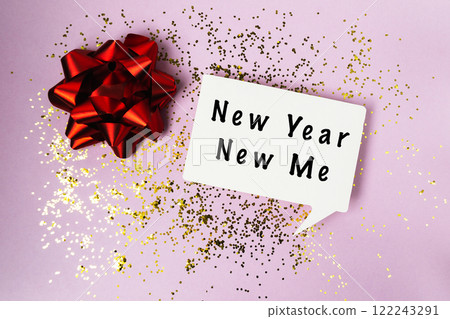 Red bow is on top of a white sign that says New Year New Me 122243291