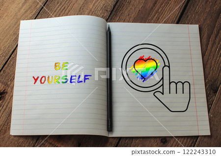 Notebook with a rainbow heart and the words be yourself written on it 122243310