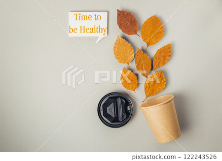 Coffee cup and a leafy tree with the words Time to be healthy Coffee cup and a leafy tree with the words Time to be healthy 122243526