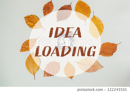A clock surrounded by autumn leaves 122243581