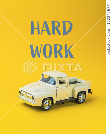 A toy truck with the words hard work written on it 122243677