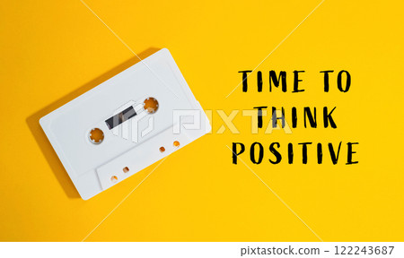 a yellow background with the words Time to Think Positive 122243687