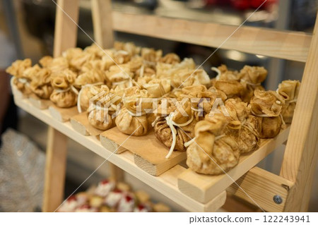 An Elegant Assortment of Gourmet Desserts and Savory Snacks Beautifully Arranged on Table 122243941