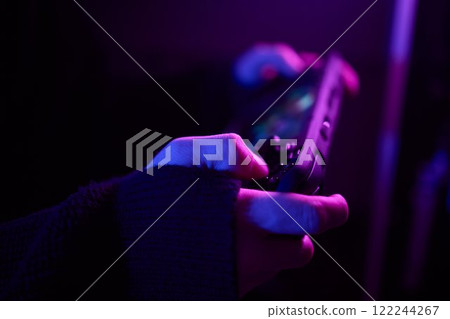 Enjoy an exciting gaming session with a handheld console full of thrills and adventures Enjoy an exciting gaming session with a handheld console full of thrills and adventures 122244267