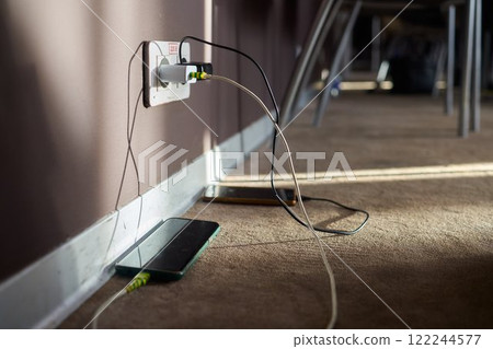 Tips and Considerations for Efficiently Charging Devices Near a Wall Outlet in Your Space Tips and Considerations for Efficiently Charging Devices Near a Wall Outlet in Your Space 122244577