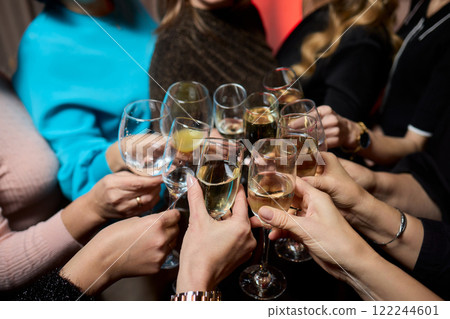 Cheers to a Fantastic Celebration Friends Joyfully Toasting with Wine Glasses in Hand 122244601