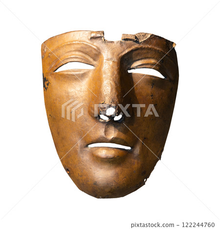 Damaged bronze mask on white background Damaged bronze mask on white background 122244760