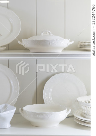 White porcelain dishes displayed on shelf 122244766