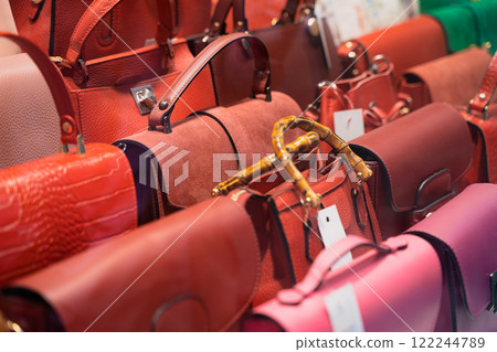 Colorful handbags on display in a boutique shop Colorful handbags on display in a boutique shop 122244789