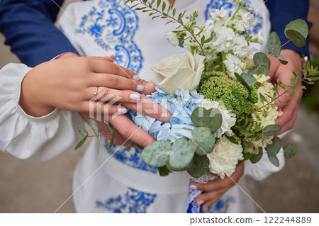 A stunning and beautiful floral bouquet featuring lovely eucalyptus and vibrant blue hydrangeas 122244889