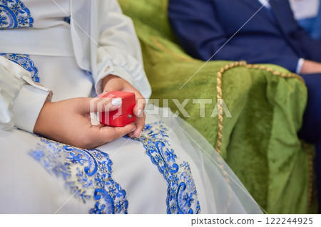 Cherished Engagement Moment with the Beautiful Ring Inside the Luxurious Red Box 122244925