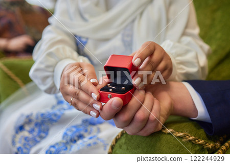 Cherished Engagement Moment with the Beautiful Ring Inside the Luxurious Red Box 122244929