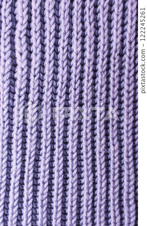 Texture of purple knitted yarn. Knitted and winter clothes 122245261