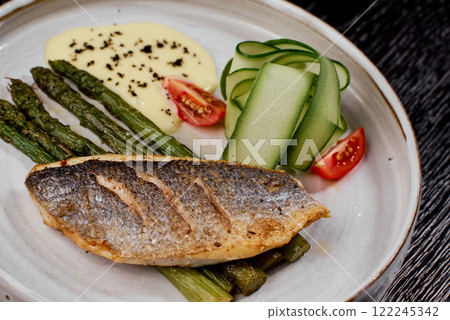 Close-Up of Grilled Sea Bass with Asparagus. 122245342