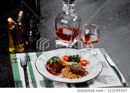 Elegant Beef Medallions with Sophisticated Garnish. 122245347
