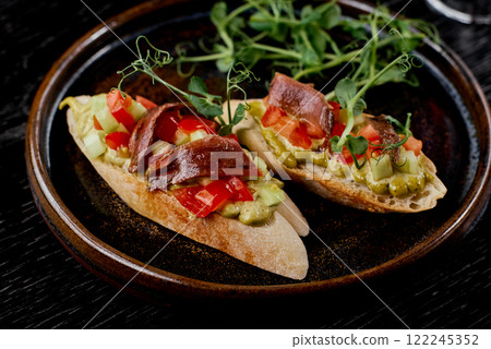 Anchovy and Avocado Crostini with Fresh Vegetables. Anchovy and Avocado Crostini with Fresh Vegetables. 122245352
