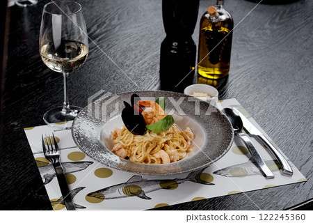 Seafood Pasta with Basil and Creamy Sauce Presentation. Seafood Pasta with Basil and Creamy Sauce Presentation. 122245360