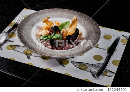Seafood Risotto with Mussels and Basil on Decorative Plate. Seafood Risotto with Mussels and Basil on Decorative Plate. 122245391