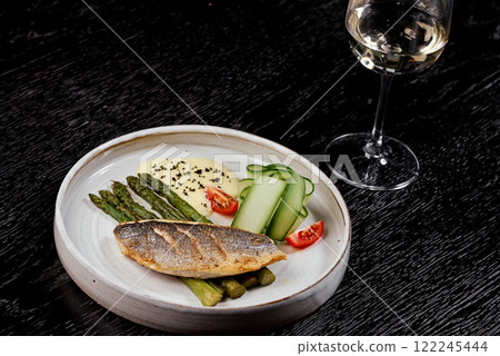 Grilled Sea Bass with Asparagus and Hollandaise Sauce. 122245444