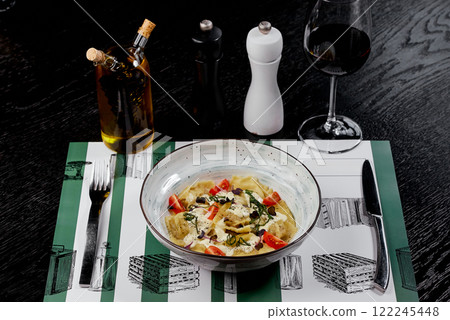 Tortellini in Creamy Sauce with Cherry Tomatoes and Basil. 122245448