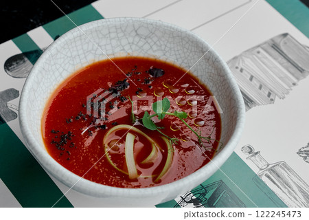 Close-Up of Tomato Soup with Fresh Garnish. Close-Up of Tomato Soup with Fresh Garnish. 122245473