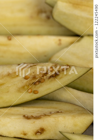 the flesh and seeds of sliced ripe eggplant the flesh and seeds of sliced ripe eggplant 122245490