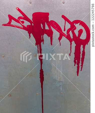 metal door with red graffiti 122245798