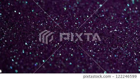 Blur powder. Purple glitter. Flare shimmering festive surface with fine metallic dust. Violet glow on precious lilac glamour particles. 122246599