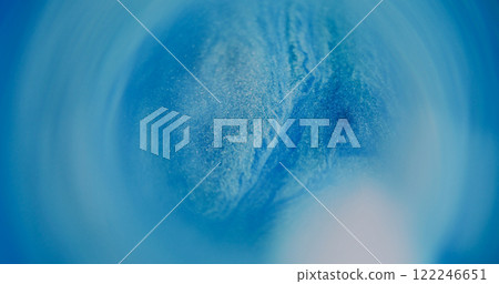 Shimmering flow. Blur spill. White blue color fluid blinking liquid paint ink bright dust circling on abstract bokeh light background. 122246651