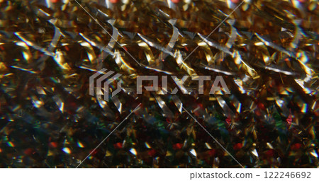 Blur celebrate decoration. Sparkling light. Gleaming golden white multicolor particles bright lens flare moving on abstract background. 122246692