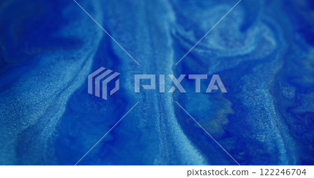 Blur glitter fluid. Shiny liquid spill. Gleaming white blue color blinking liquid paint ink bright dust moving on abstract bokeh light background. 122246704