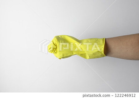 Hand in yellow glove. Housekeeping concept Hand in yellow glove. Housekeeping concept 122246912