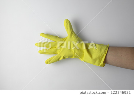 Cleaning concept. A hand in a yellow glove for cleaning 122246921