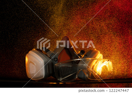 In rain spray of toxic chemicals, mask is essential object for health safety. Combined with protective glasses, industrial gas mask offers vital protection against gas, smoke, dust, and pollution In rain spray of toxic chemicals, mask is essential object for health safety. Combined with protective glasses, industrial gas mask offers vital protection against gas, smoke, dust, and pollution 122247447