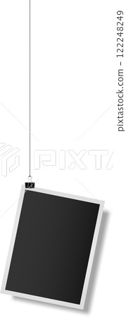 Photo frame hanging with binder clip showing a blank space where you can add your content, perfect for showcasing your designs or creating personalized memories 122248249