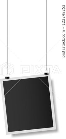 Realistic empty photo frame hanging on strings with binder clips against a white background, serving as a vintage mockup for retro snapshots and scrapbook designs Realistic empty photo frame hanging on strings with binder clips against a white background, serving as a vintage mockup for retro snapshots and scrapbook designs 122248252